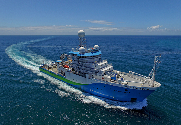 Investigator in open ocean. Photo credit: Owen Foley & MNF